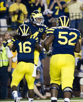 Denard Robinson (16), Jeremy Gallon (10), and Ricky Barnum (52)