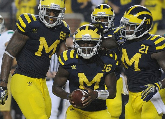 Kevin Koger (86), Denard Robinson (16), and Junior Hemingway (21)