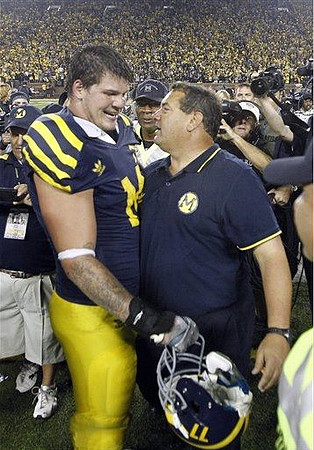 Taylor Lewan (77) and Brady Hoke
