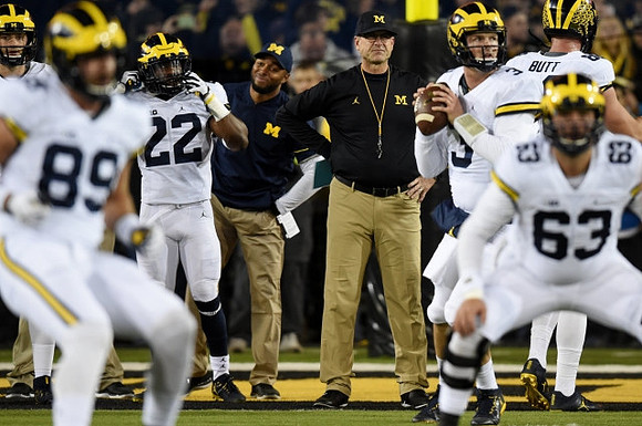 Ian Bunting (89), Karan Higdon (22), Jim Harbaugh, Wilton Speight (3), Jake Butt (88), and Ben Pliska (63)