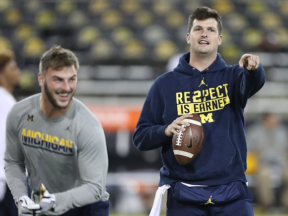 Jake Butt (88) and Wilton Speight (3)