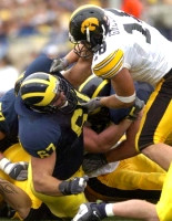 Matt Lentz (67) and Chad Henne (7)