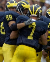 Tyler Ecker (89) and Chad Henne (7)