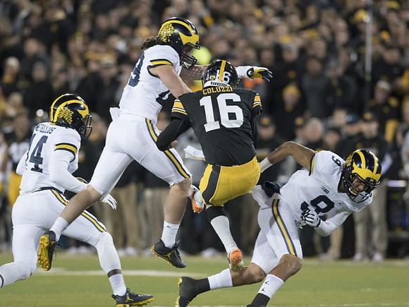 Josh Metellus (14), Jordan Glasgow (29), and Grant Perry (9)