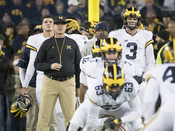 John O'Korn (8), Jim Harbaugh, Chris Evans (12), Shane Morris (7), Ben Pliska (63), and Wilton Speight (3)