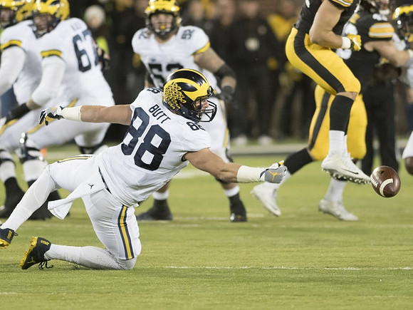 Kyle Kalis (67), Jake Butt (88), and Mason Cole (52)