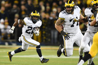 Karan Higdon (22), Ben Braden (71), and Jehu Chesson (86)