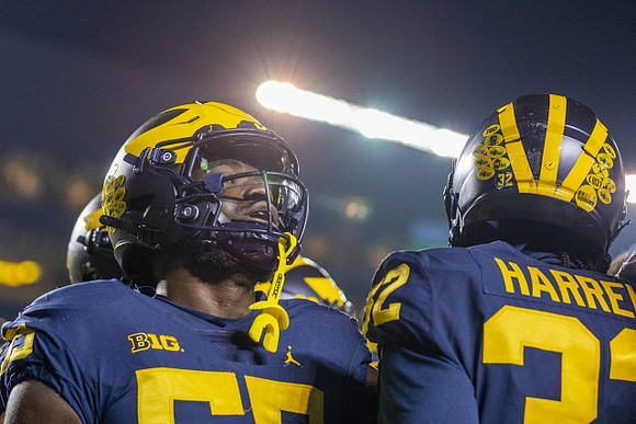 David Ojabo (55) and Jaylen Harrell (32)