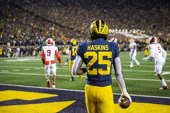 Roman Wilson (14) and Hassan Haskins (25)