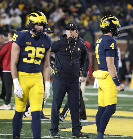 Luke Buckman (35), Jim Harbaugh, and Dan Villari (4)