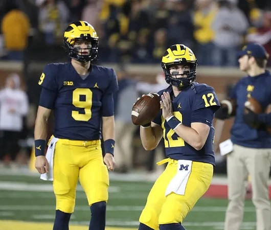 J.J. McCarthy (9) and Cade McNamara (12)