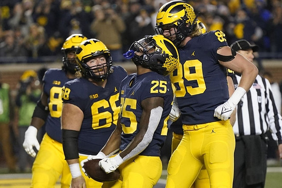 Trente Jones (80), Zak Zinter (65), Hassan Haskins (25), and Carter Selzer (89)