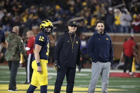 Cade McNamara (12) and Jim Harbaugh