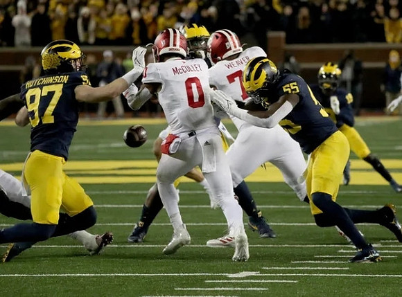 Aidan Hutchinson (97), David Ojabo (55), and Rod Moore (19)