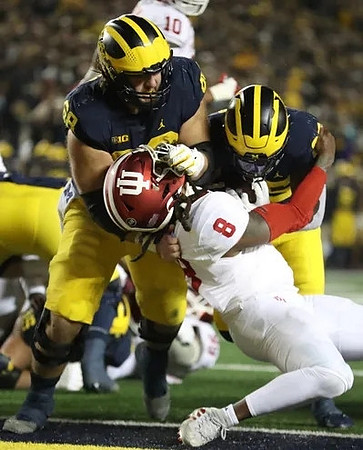 Andrew Vastardis (68) and Hassan Haskins (25)