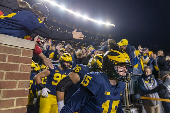Alan Bowman (15) and Michigan Team