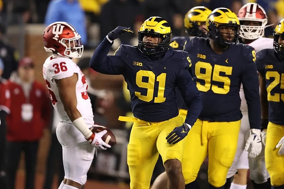 Taylor Upshaw (91), Donovan Jeter (95), and Junior Colson (25)