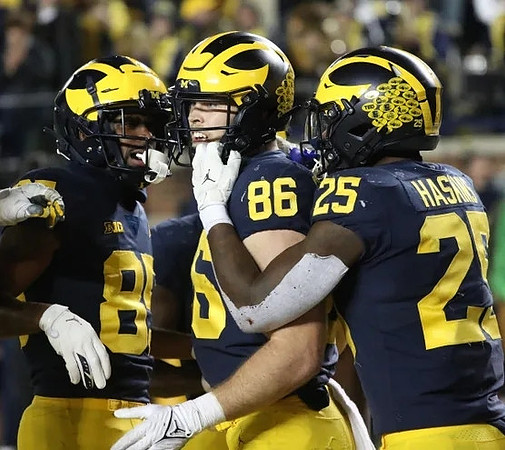 Daylen Baldwin (85), Luke Schoonmaker (86), and Hassan Haskins (25)