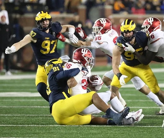 Aidan Hutchinson (97), Taylor Upshaw (91), and Julius Welschof (96)