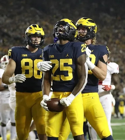Luke Schoonmaker (86), Hassan Haskins (25), and Carter Selzer (89)