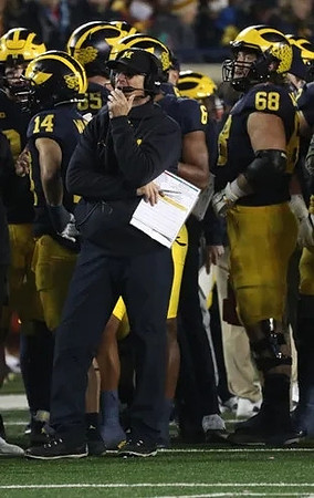 Roman Wilson (14), Jim Harbaugh, and Andrew Vastardis (68)
