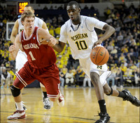 Jordan Morgan (52) and Tim Hardaway Jr. (10)