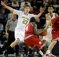 Evan Smotrycz (23) and Jon Horford (15)