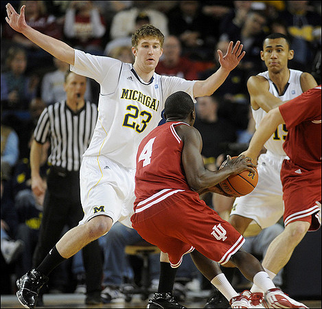 Evan Smotrycz (23) and Jon Horford (15)