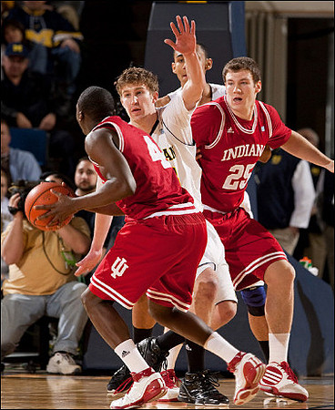 Evan Smotrycz (23) and Jon Horford (15)