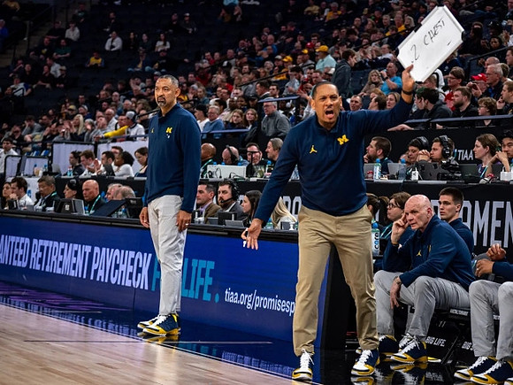 Juwan Howard, Howard Eisley, and Phil Martelli