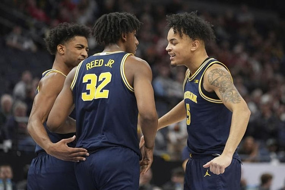 Jace Howard (25), Tarris Reed Jr. (32), and Terrance Williams II (5)