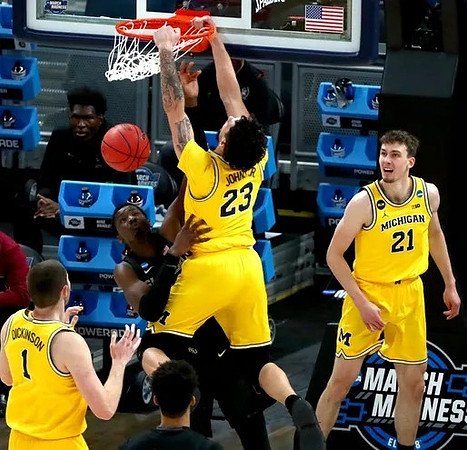 Hunter Dickinson (1), Brandon Johns Jr. (23), and Franz Wagner (21)