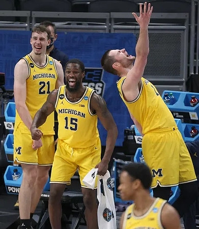 Franz Wagner (21), Chaundee Brown Jr. (15), Hunter Dickinson (1), and Zeb Jackson (3)