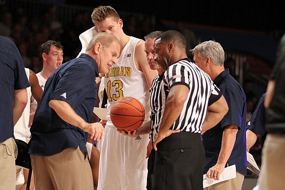 Ricky Doyle (32), John Beilein, Moritz Wagner (13), and Jeff Meyer