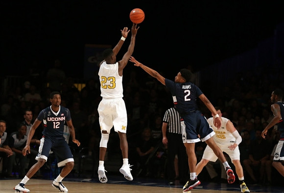 Caris LeVert (23) and Ricky Doyle (32)