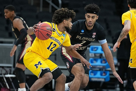 Mike Smith (12) and Brandon Johns Jr. (23)