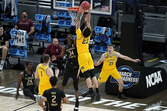 Brandon Johns Jr. (23), Hunter Dickinson (1), and Franz Wagner (21)