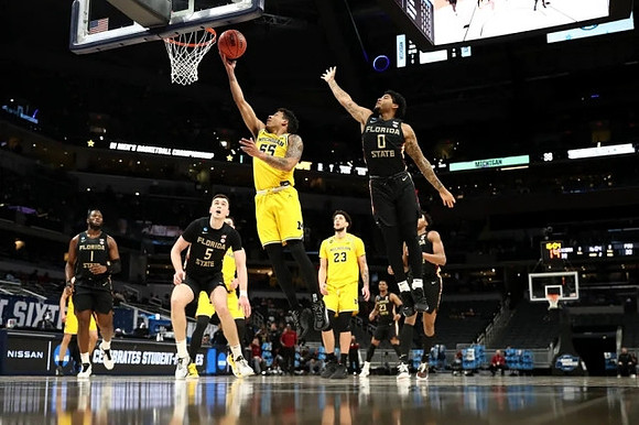 Eli Brooks (55) and Brandon Johns Jr. (23)