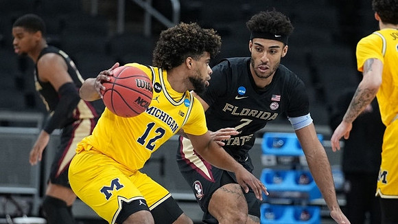 Mike Smith (12) and Brandon Johns Jr. (23)