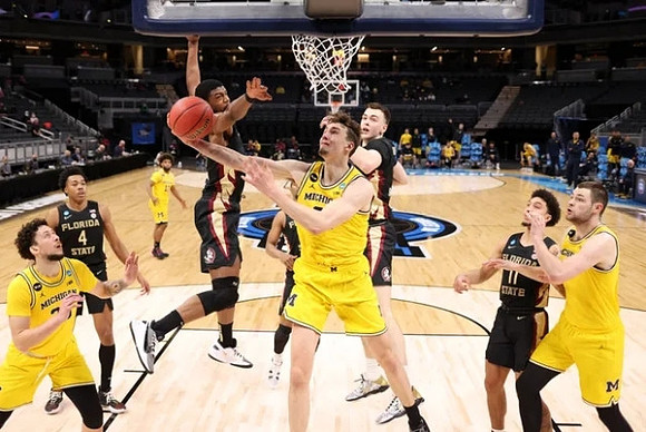 Franz Wagner (21), Brandon Johns Jr. (23), Mike Smith (12), and Hunter Dickinson (1)