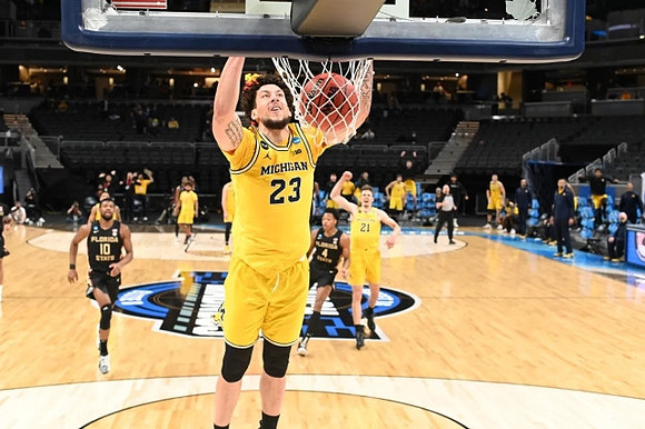 Brandon Johns Jr. (23), Franz Wagner (21), and Mike Smith (12)
