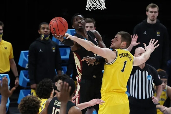 Hunter Dickinson (1) and Brandon Johns Jr. (23)