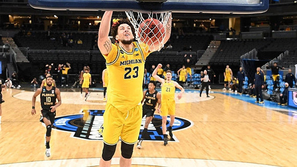 Brandon Johns Jr. (23), Mike Smith (12), and Franz Wagner (21)