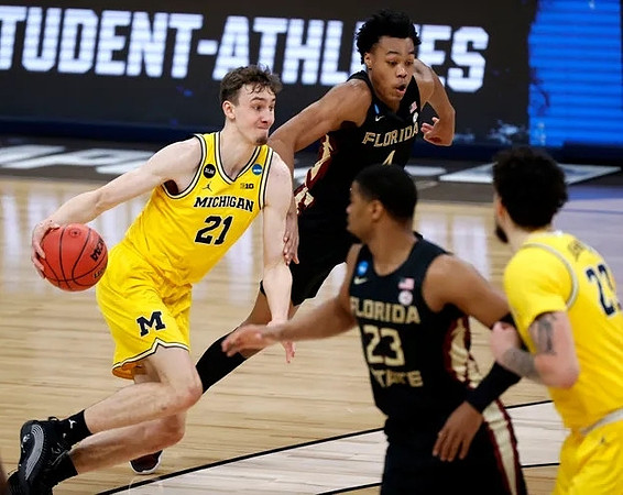 Franz Wagner (21) and Brandon Johns Jr. (23)