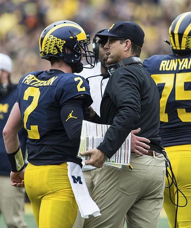 Shea Patterson (2), Jim Harbaugh, and Jon Runyan Jr. (75)