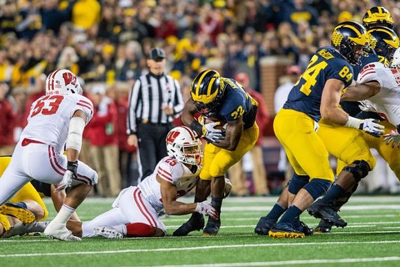 Karan Higdon (22) and Sean McKeon (84)
