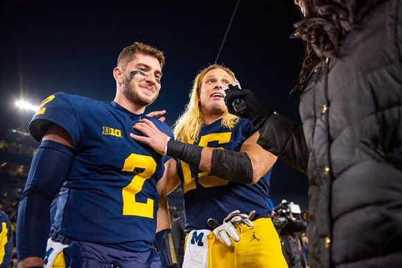 Shea Patterson (2) and Chase Winovich (15)