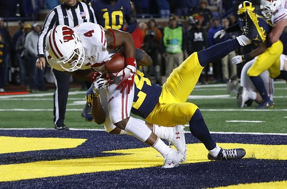 Lavert Hill (24) and Devin Bush (10)