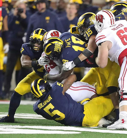 Khaleke Hudson (7), Aubrey Solomon (5), Kwity Paye (19), and Chase Winovich (15)