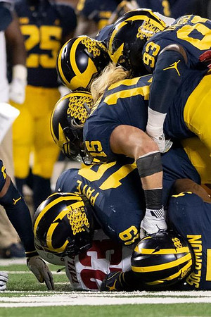 Aubrey Solomon (5), Kwity Paye (19), Chase Winovich (15), and Lawrence Marshall (93)